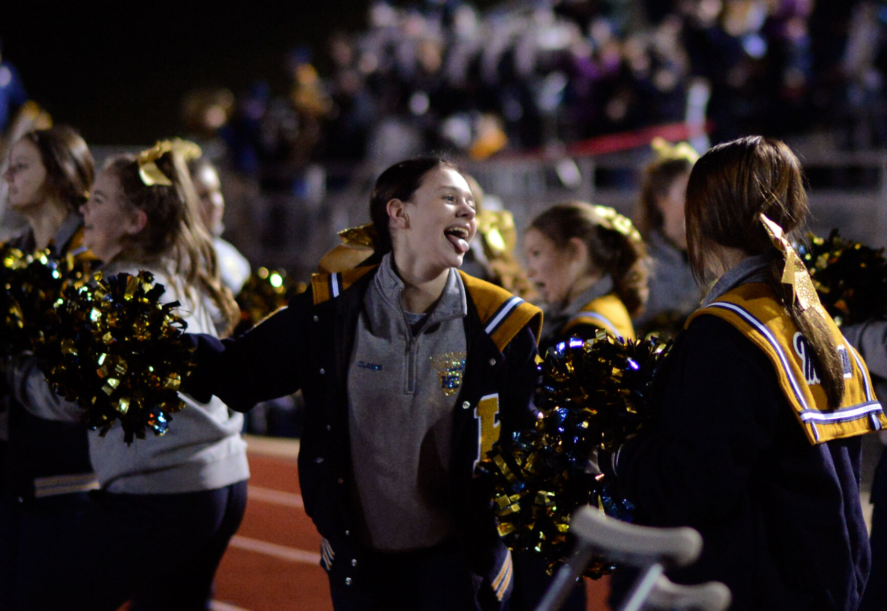 Freshman Helias cheerleader Claire Schnieders yells with her team